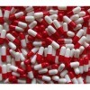 200 capsules taille 1 rouge/blanc